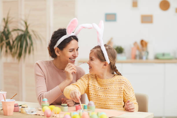 istock Mother and Daughter Enjoying Easter Preparations 1203971932