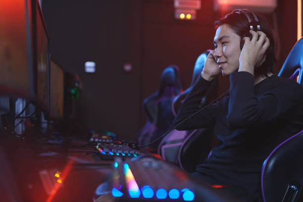istock Excited Asian Gamer 1203972756