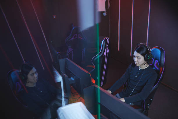istock High Angle at Asian Man Playing Videogame 1203972795