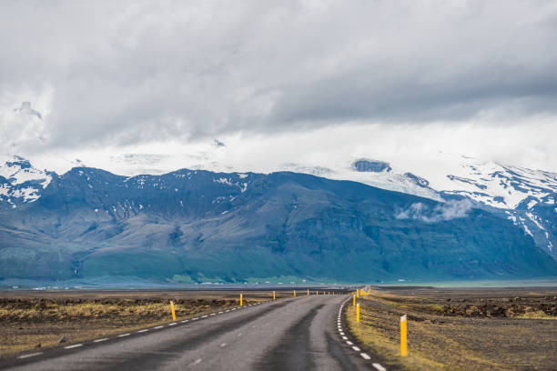 istock Iceland mountains view from ring road trip highway and snowcapped mountain cliff on cloudy day near Hof and Skaftafell national park 1203972973