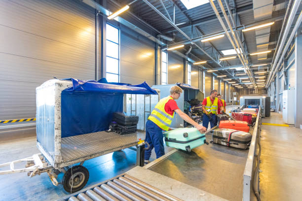Airport service crew unloading luggage