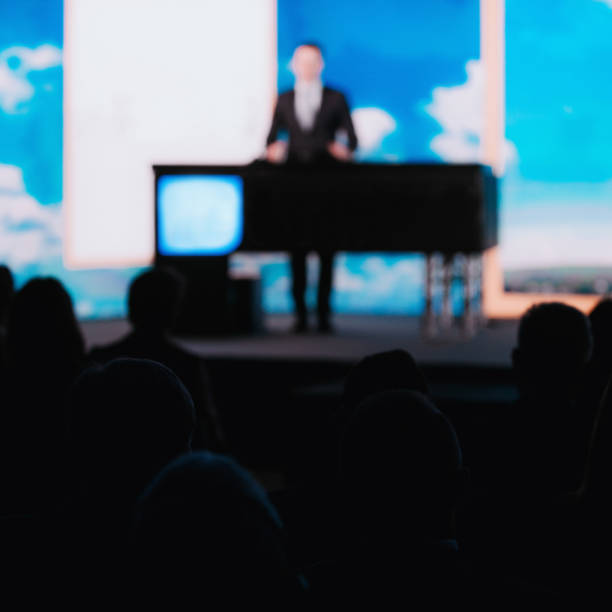 istock Male Speaker On The Stage 1203973581