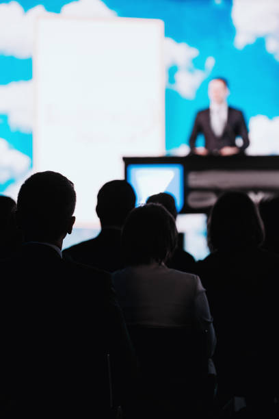 istock Presentation Of A Speaker On The Stage 1203973641