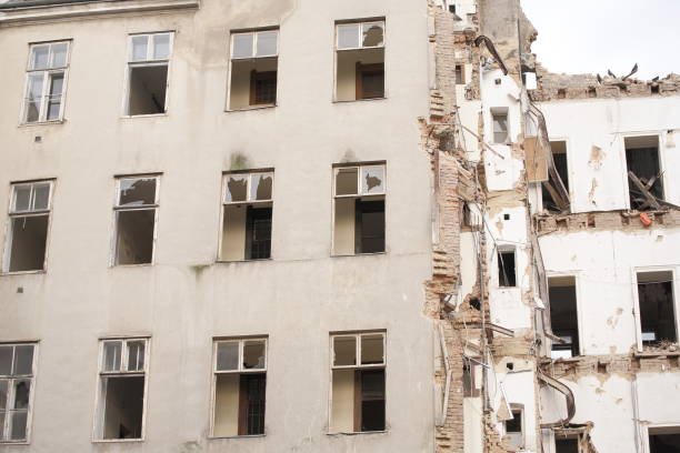 Demolished multistory building with sky, low-angle shot. demolition, renovation, earthquake concept