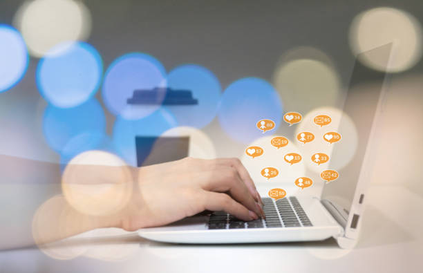 istock Hand chat on a portable computer social media 1203980808
