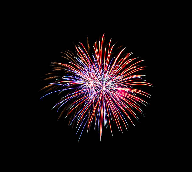 istock Beautiful colorful fireworks exploding in the night sky, isolated on black background 1203982758