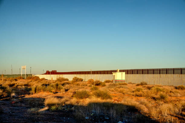 The Border Wall Between the United States and Mexico at the Santa Teresa Crossing from New Mexico and the Mexican State of Chihuahua in the Early Hours of the Daya The Border Wall Between the United States and Mexico at the Santa Teresa Crossing from New Mexico and the Mexican State of Chihuahua in the Early Hours of the Daya new mexico state police stock pictures, royalty-free photos & images