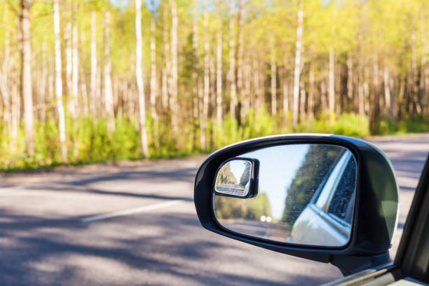 istock side mirror of car on countryside road 1203982965