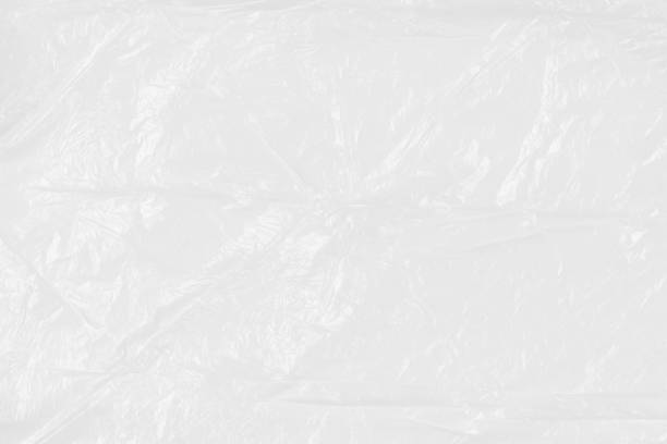 istock Texture of a white crumpled plastic bag. Close up 1203985273