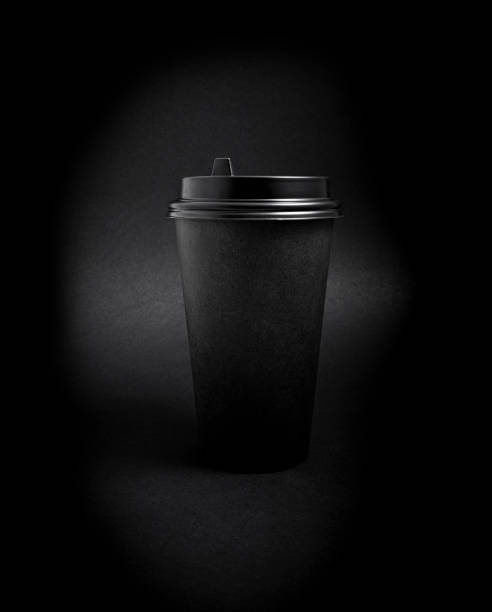 istock Black takeaway paper coffee cup over black 1203985566