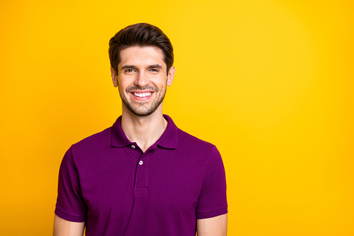 Close-up portrait of his he nice attractive cheery cheerful guy wearing, lilac shirt isolated over bright vivid shine vibrant yellow color background