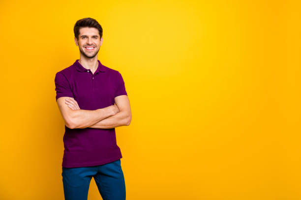 istock Portrait of his he nice attractive cheerful cheery content brown-haired guy folded arms copy space isolated over bright vivid shine vibrant yellow color background 1203987721