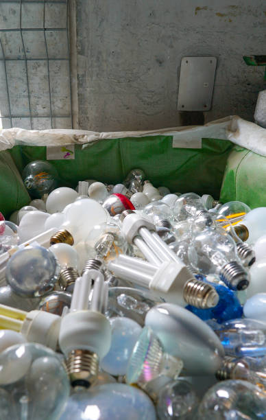 istock selective focus view of large recycling bin filled with many different size and color light bulbs 1203987813