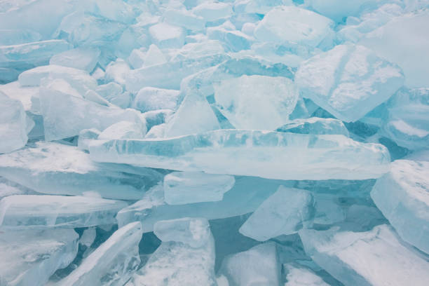 istock Transparent pieces of ice, winter background. 1203987842