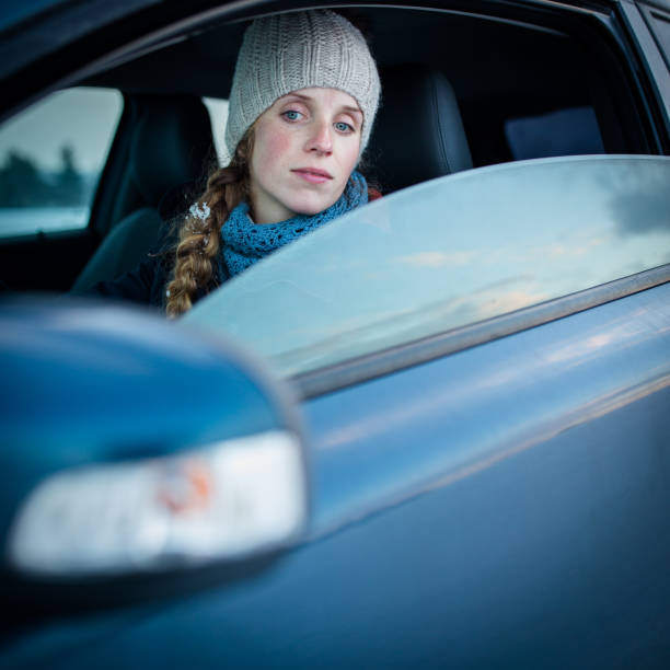 istock Woman driving a car 1203988269