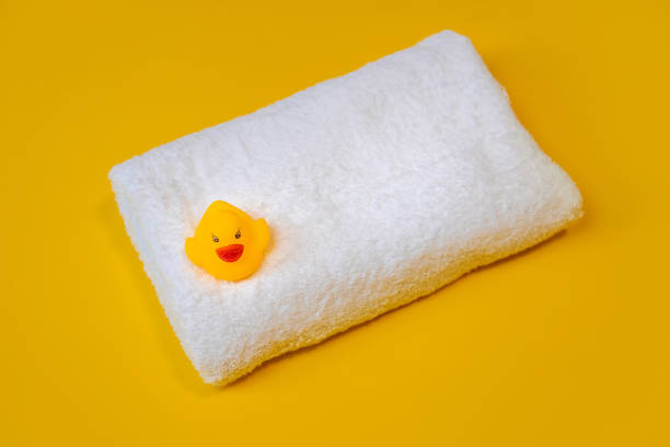 istock Accessories for swimming duck on a yellow background. Selective focus. 1203988656