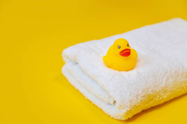 istock Accessories for swimming duck on a yellow background. Selective focus. 1203989421