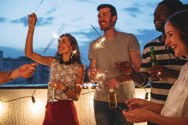 istock Happy People Holding Sparklers 1203991703