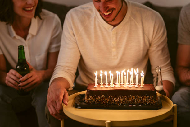 istock Young Man Having Birthday Party 1203991809