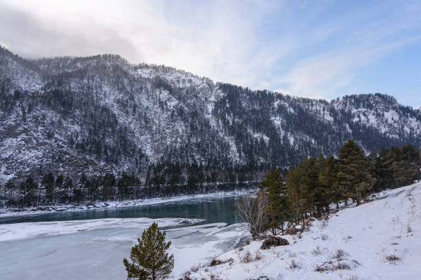 istock View of snow-capped mountains and mountain river 1203991976