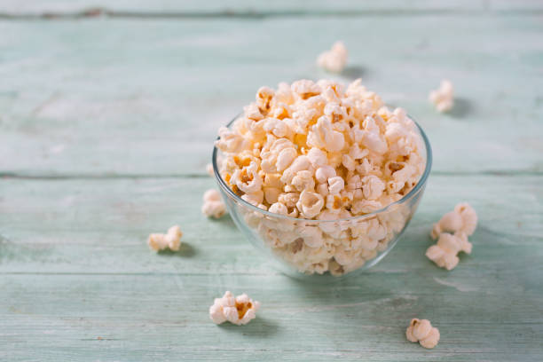 istock salty popcorn on turquoise wooden surface 1203992016