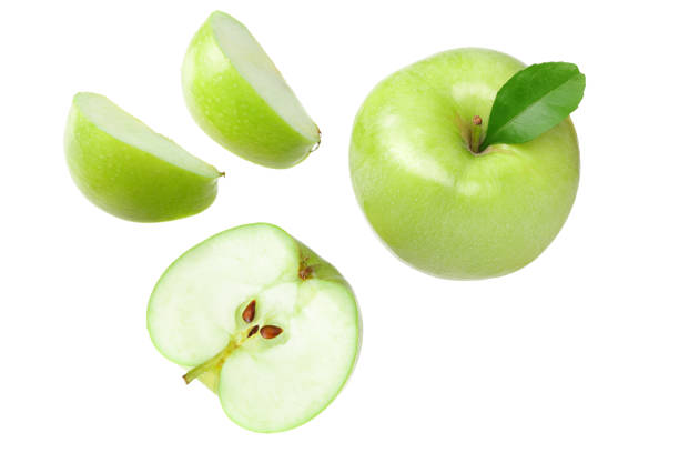 istock green apples with slices isolated on white background. top view 1203993231