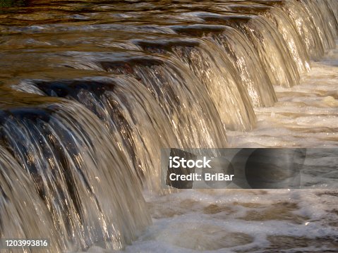 istock Waterfall Stream over Weir 1203993816
