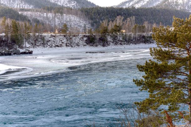 istock Stream of a freezing mountain river 1203994147