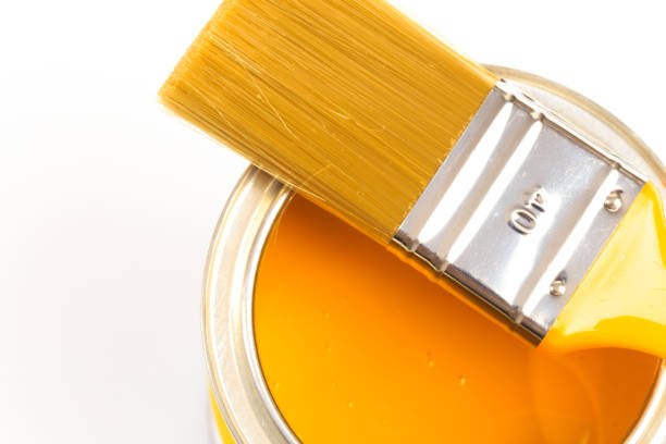 istock Can with yellow paint with brush isolated on white background - Image 1203996819