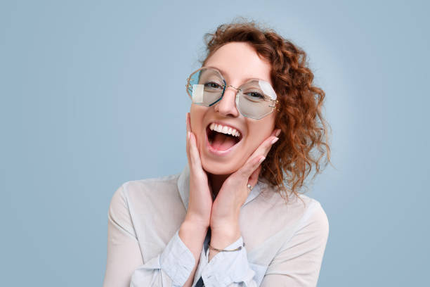 istock Beautiful cheerful curly girl happily exclaimed 1203997183