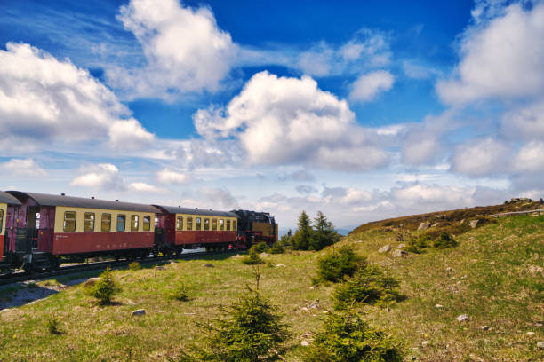 Looking at the Brocken Railway (German: Brockenbahn) who is very popular because they use historic steam trains on the Brocken Railway and have become very popular with thousands of tourists every year, offering convenient access to the top of the Brocken. The Brocken also sometimes referred to as the Blocksberg, is the highest peak of the Harz mountain range with 1,141 meters high. The Brocken has always played a role in legends and has been connected with witches and devils; Johann Wolfgang von Goethe took up the legends in his play Faust.