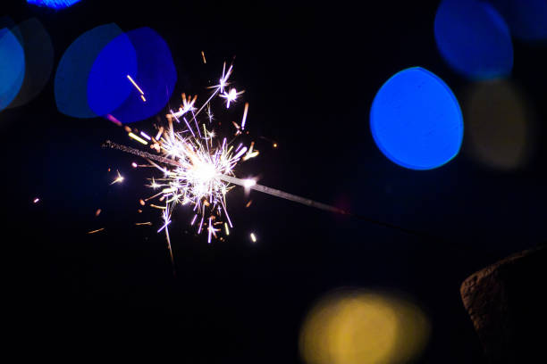 istock Sparks in the dark. Sparks. Christmas and New Year time. Magic light 1204000484