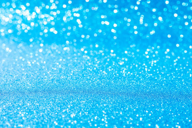 istock Horizontal blue glitter background with blur and bokeh 1204001515