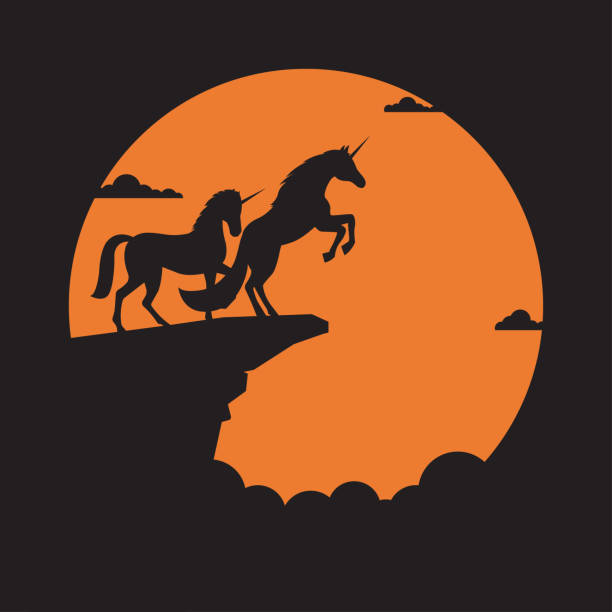 istock Silhouette unicorn horse on cliff with sunset background 1204001552