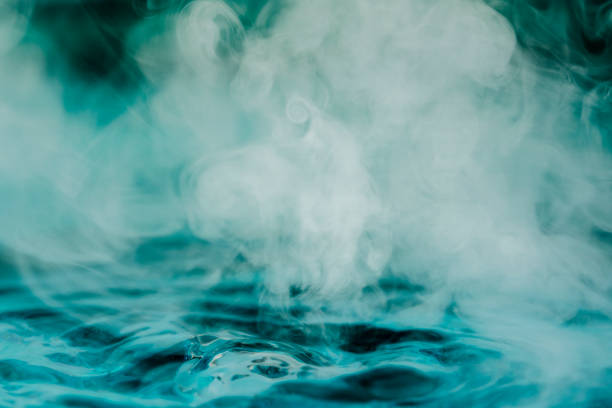 istock teal blue abstract background with steam and water 1204006525