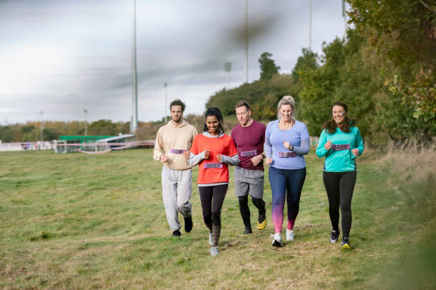 istock Competitors running together at outdoor charity event 1204006645