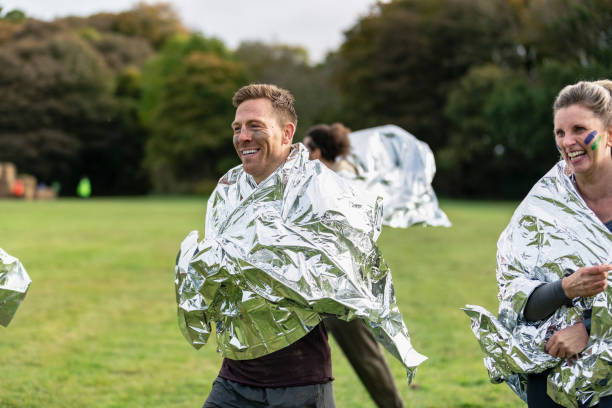 istock Charity runners wearing foil blankets after race 1204006859
