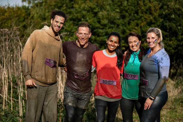 istock Cross country runners posing for camera after race 1204007787