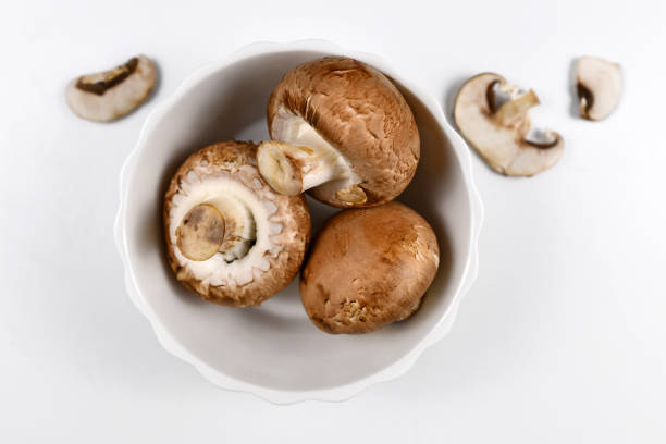 istock Brown button mushrooms in white bowl 1204008170