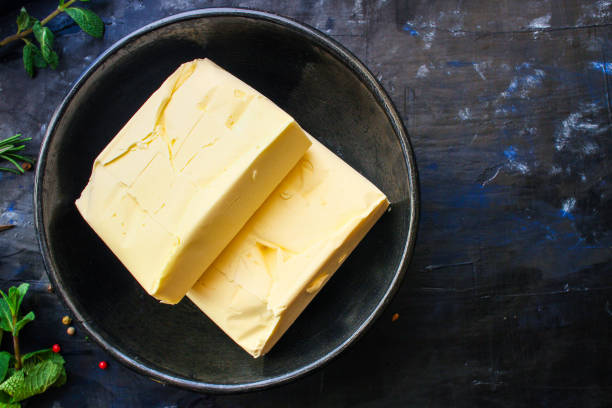 istock butter or margarine piece (product spread) menu concept. background. top view. copy save 1204008209