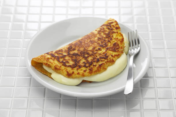 istock cachapa, venezuelan corn pancake with handmade cheese 1204009373