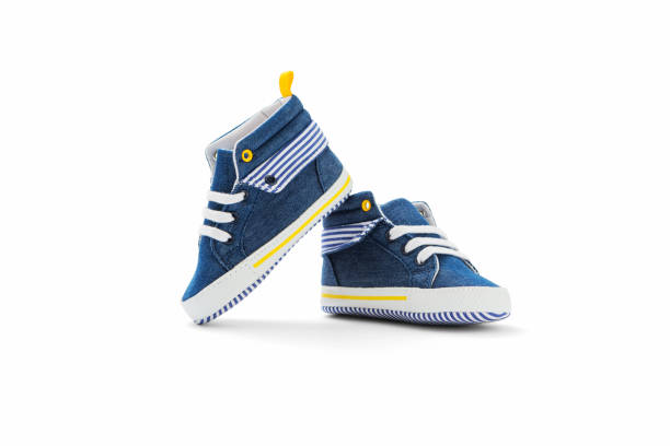 Baby sneakers Baby sneakers on white background, including clipping path baby booties stock pictures, royalty-free photos & images