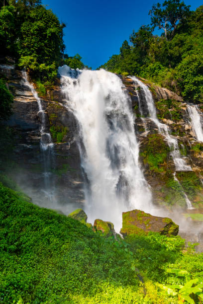 istock Wachirathan Waterfall at Doi Inthanon National Park, Mae Chaem District, Chiang Mai Province, Thailand. Fresh flowing water in tropical rainforest. Green trees, vibrant colors, tranquility. 1204013162