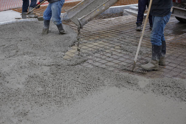 istock workers pouring wet concrete using concrete bucket. Industrial construction. 1204013226