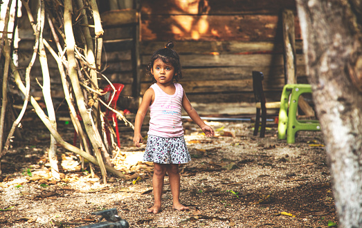 Childhood. Portrait of young girl, Mexican ethnicity, outside.