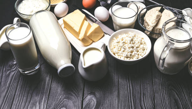 istock Different dairy products on black wooden table 1204014117