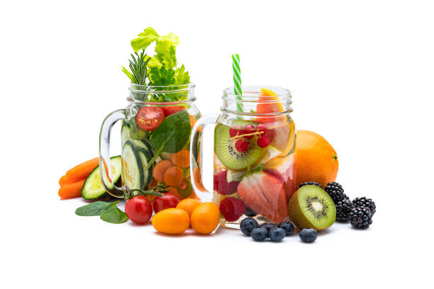 istock Fruit and vegetables infused water isolated shot on reflective white background 1204015161