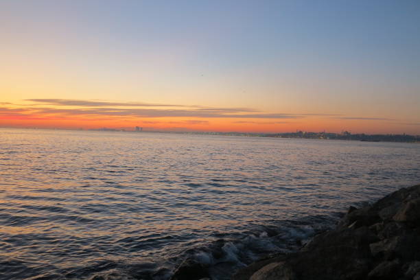 istock Kadikoy sea coast sunset sky Istanbul Turkey 1204016604