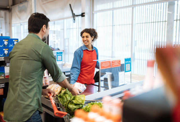 istock Latina cashier at supermarket 1204016841