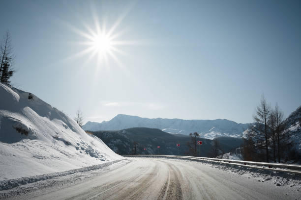 istock Winter road on mountains. Sunny weather. 1204018133